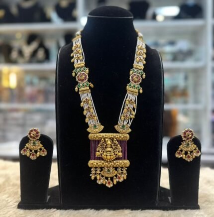 real look temple set with ruby moti mala and laxmi ji on it