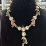 Magnificent Stylish Green And Pink Kundan Mozonite set with astonishing bird design